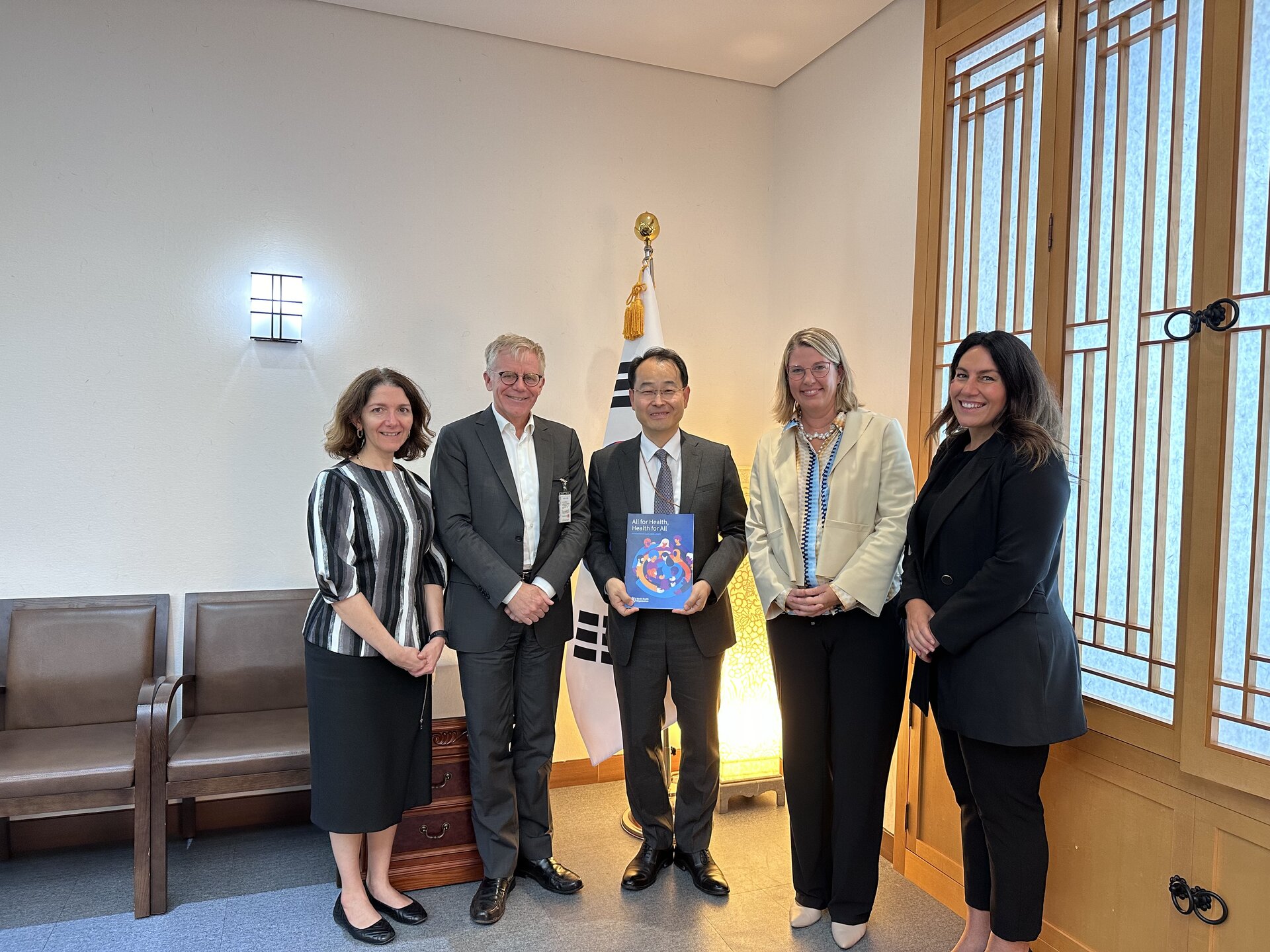 WHO delegation with Mr Jonghan Park, Director-General, Development Cooperation (Ministry of Foreign Affairs) - holding up the WHO Investment Case report